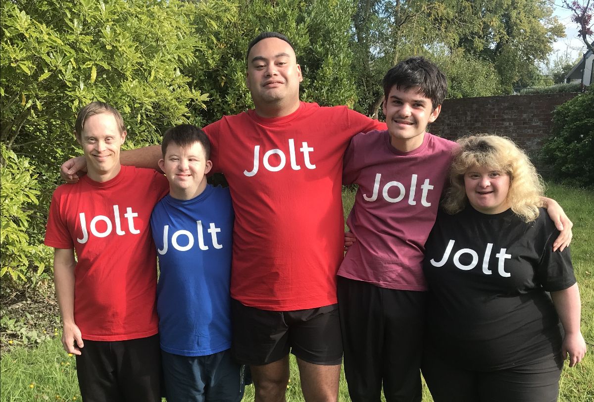 Five dancers with colourful tee-shirts and "Jolt" printed on the front